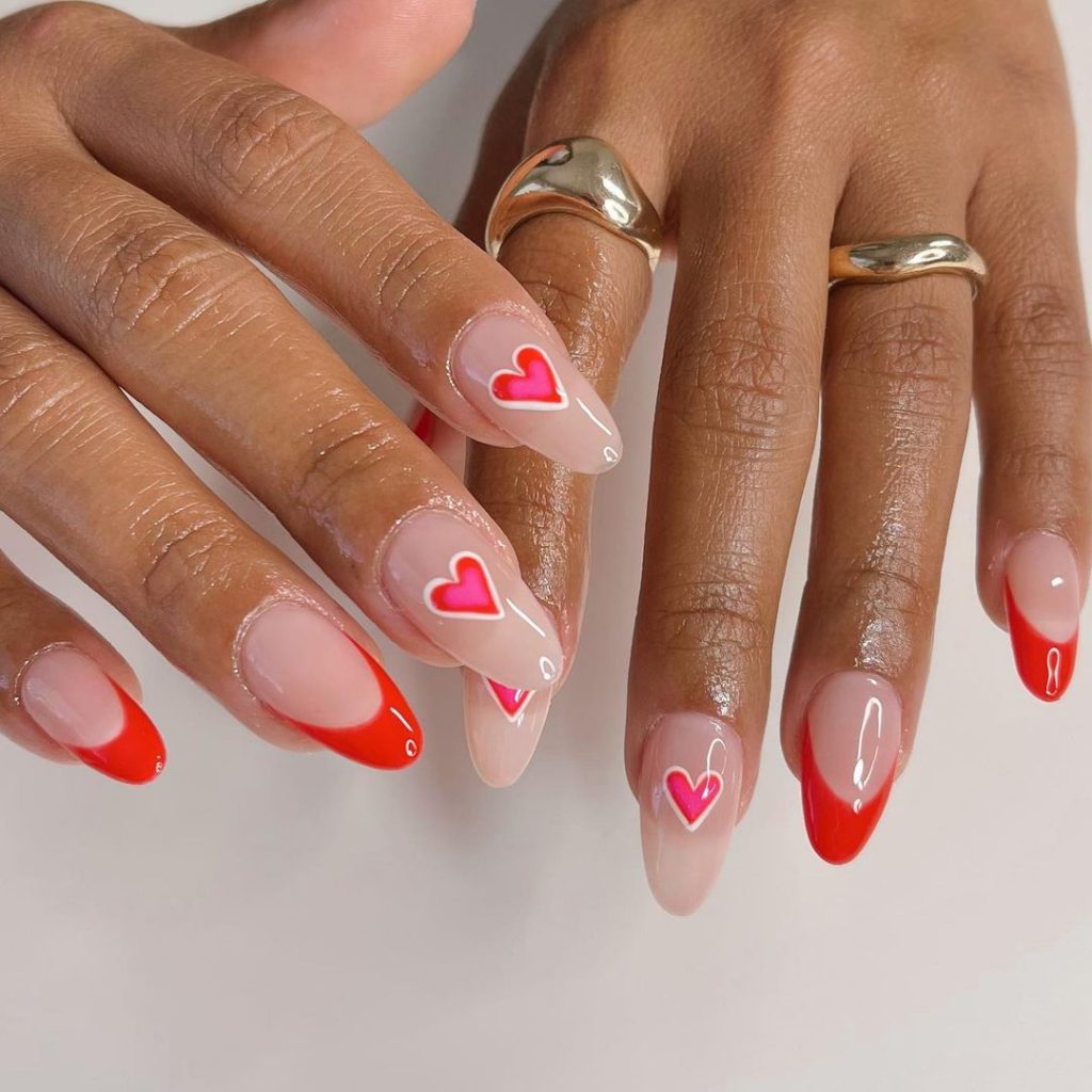 white nails with red heart	