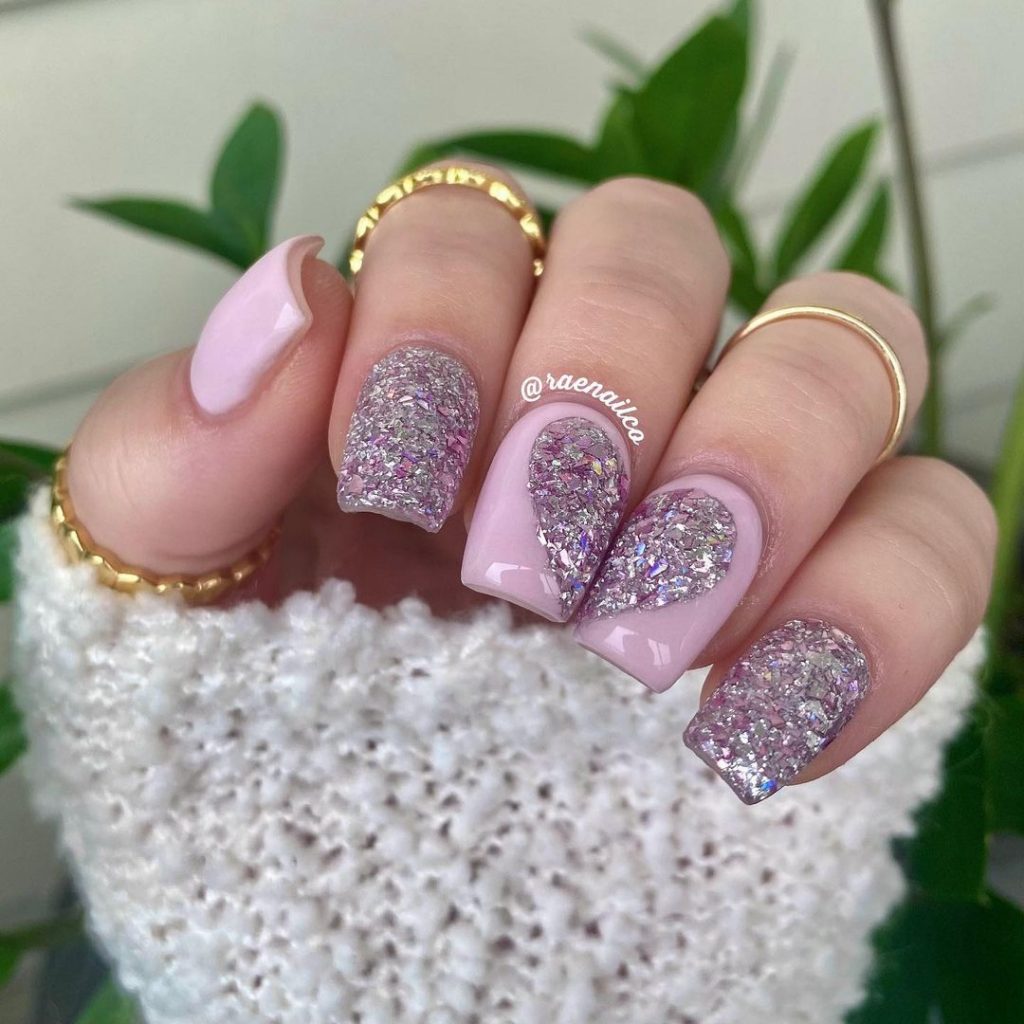 Purple nail art with hearts