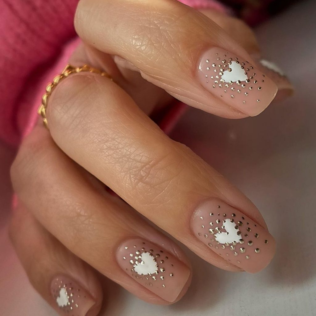 white and gold nails with hearts
