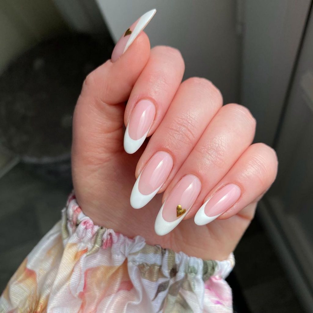 Gold heart nails with white french 
