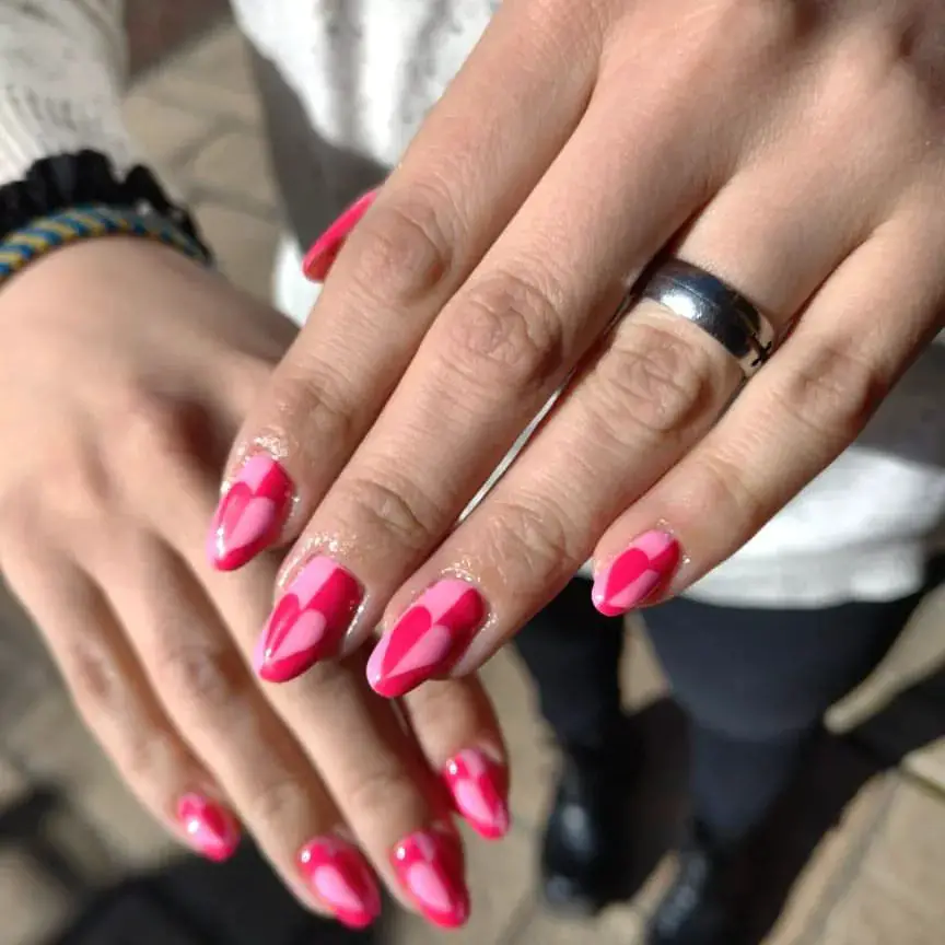 cute almond-shape nail ideas with pink hearts