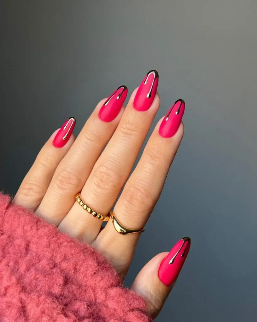 Pink nail ideas with gold dripping seasoning. 