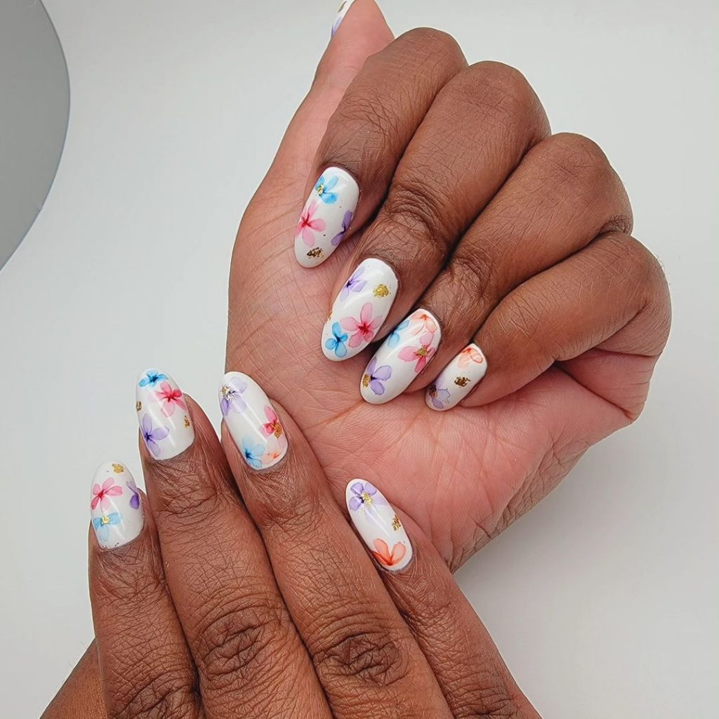 cute white nails with bright petals