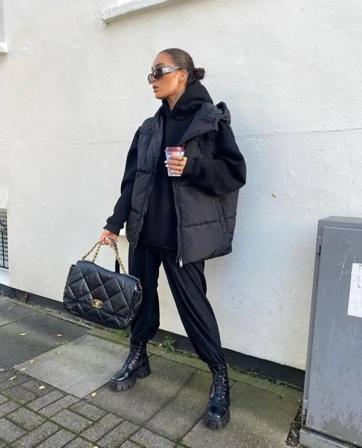 tracksuit outfit ideas with boots and padded vest