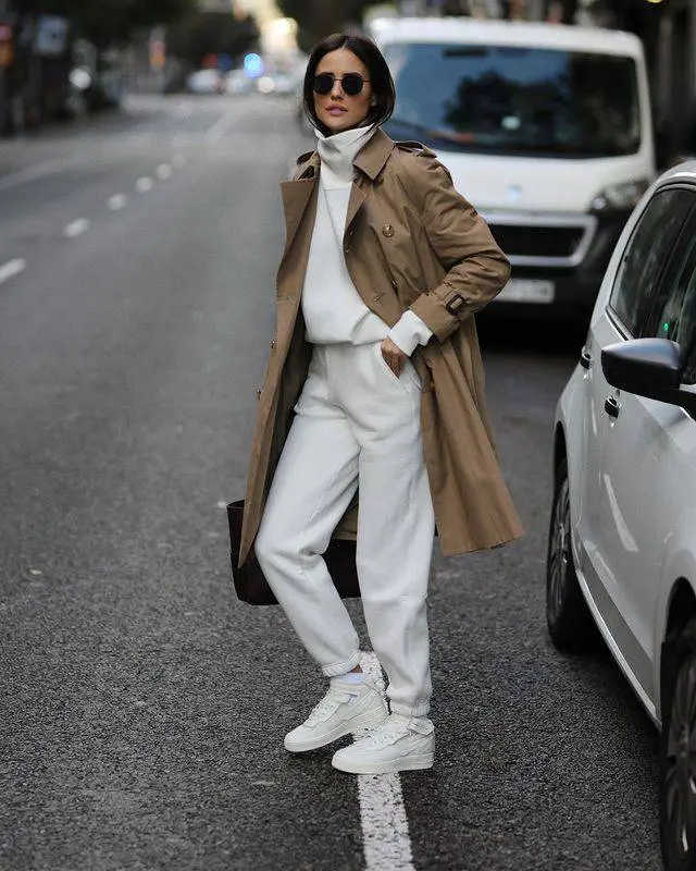 All-white tracksuit outfit with long coat