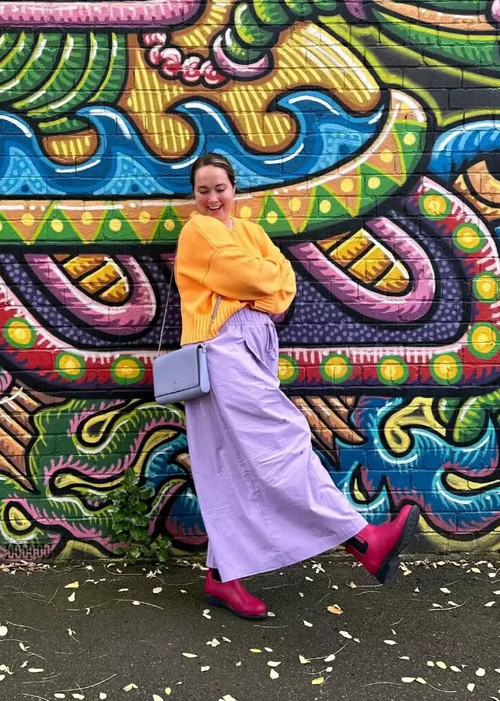Sweater and Vegan leather skirt and boots| bright colorful rainy day outfit