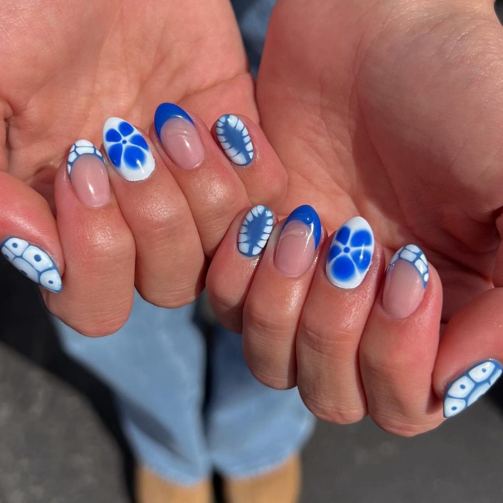 Blue and white summer-inspired nails for august manicures 