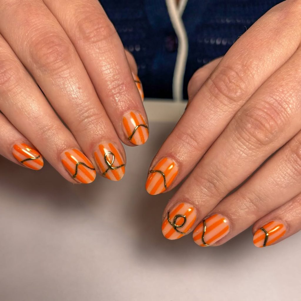 Orange gold striped nails